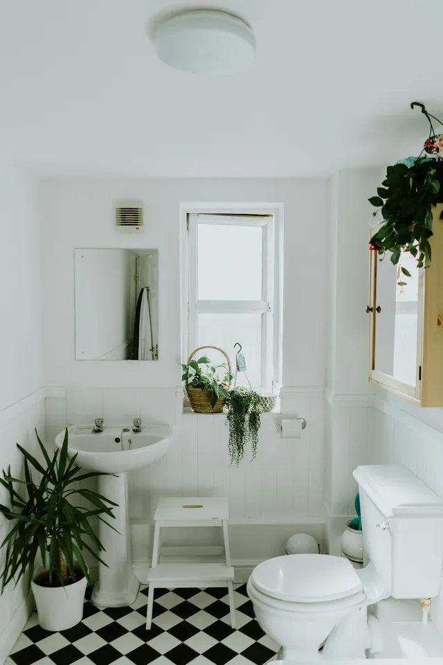 Bathroom with black and white checkered tile floor