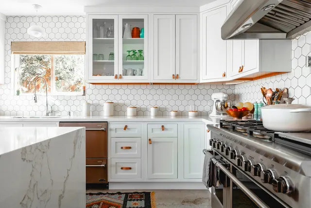 White kitchen with hexagon tile backsplash